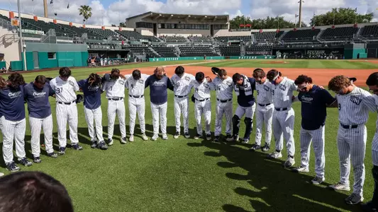 UNF Baseball team huddle at Stetson baseball field