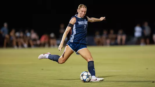 Defender Zoe Looker kicks a ball down the field