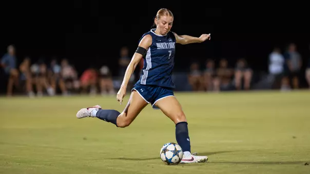 Defender Zoe Looker kicks a ball down the field