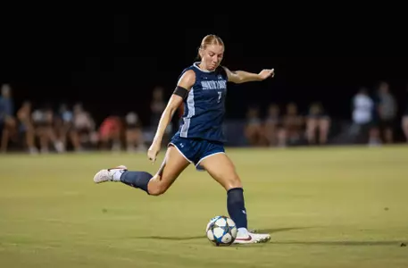 Defender Zoe Looker kicks a ball down the field