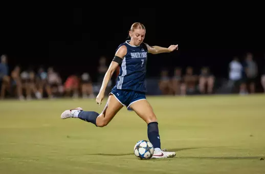Defender Zoe Looker kicks a ball down the field
