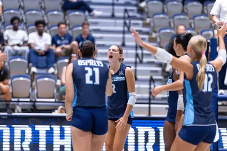 UNF Volleyball player screams in celebration after play