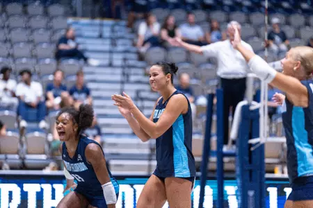 UNF Volleyball claps in celebration after play