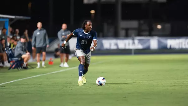 North Florida's Germain Kapela dribbling vs. South Carolina