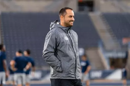 Marlon Montanella smiling looking at the field during a match