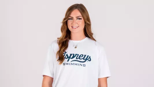 2026-27 North Florida Swimming - White Backdrop Photo of Assistant Swimming Coach Delaney Crowder
