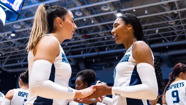 Sofia Dawson and Kendall Newbold holding arms prior to a match