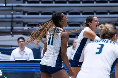 UNF volleyball player celebrates after play