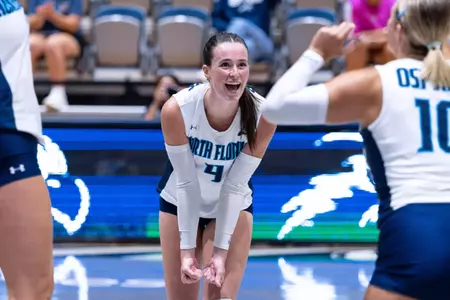 Lily Rodgers celebrates after play