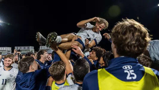 Defender Paul Schacherer celebrating with his teammates
