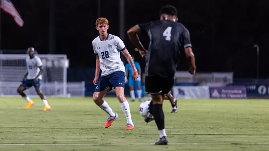 Midfielder Cameron Gray awaits and looks to defend a pass from an opposing player