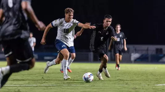 Midfielder Mark Romano ready to take a short among opposing players