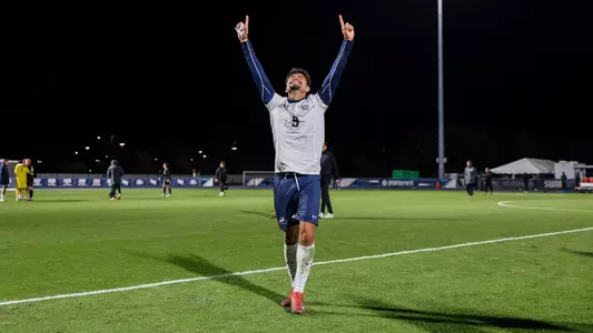 Forward Geraldo Neto celebrates by pointing to the sky