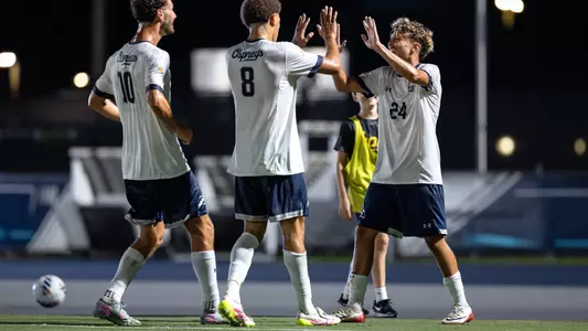 Forward Kaiss Mansouri celebrates with defender Jaylen Yearwood and midfielder Anton Khelil