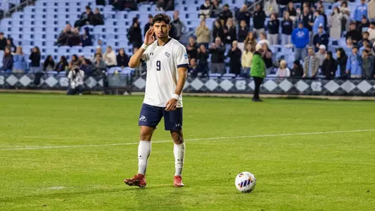Forward Geraldo Neto motions to the away crowd prior to a penalty kick
