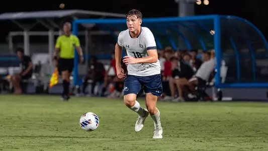 Midfielder Mark Romano looks ahead to play the ball