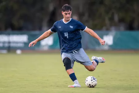 UNF Men's Soccer player kicks the ball