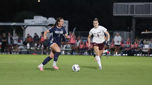Defender Julia Cosgrove with the ball against Bellarmine