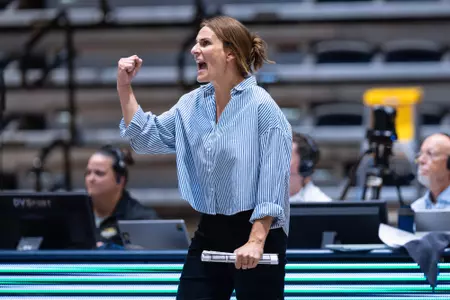Volleyball Head Coach Abby Gilleland yells in excitement