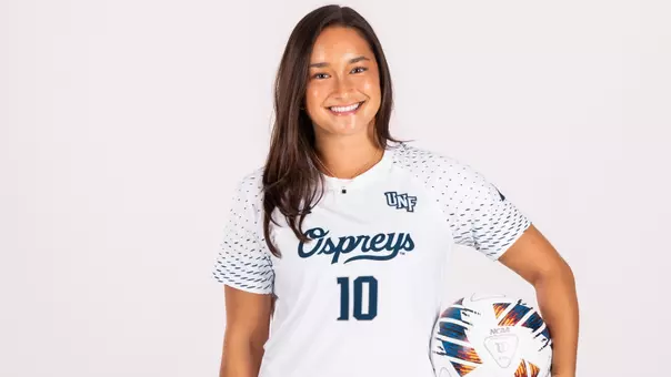White Backdrop Photo of Paige McSwigan Holding a soccer ball