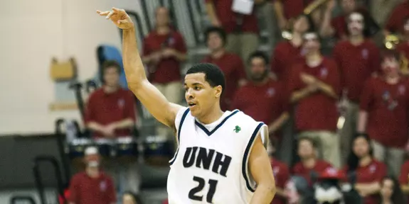 MEN'S BASKETBALL ROARS PAST VERMONT, 75-56 Image