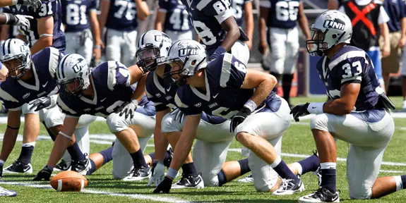 NO. 14 FOOTBALL TEAM FALLS AT MAINE, 16-13, IN OVERTIME Image