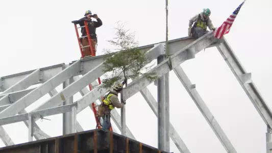 An evergreen and American flag now reside atop Wildcat Stadium.
