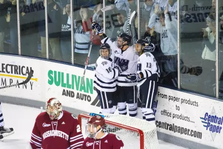 Linemates Kelleher, Poturalskii and Correale celebrate a goal.