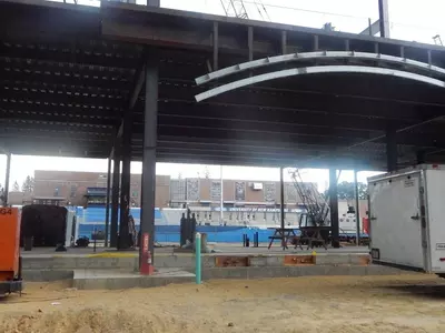 An arch frames an entrance to the new Wildcat Stadium.
