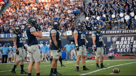 football D-Line and Crowd