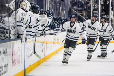 Kalle Eriksson and the Wildcats celebrate a goal in front of a large crowd against Boston College. (Jess Speechley photo)