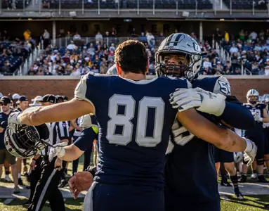 Brian Espanet (80) and Osho Omoyeni and the Wildcats hope to be celebrating again on Saturday. (Rick Wilson photo)
