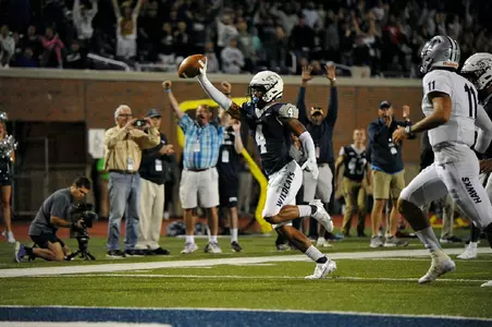 Randall Harris heads to the end zone with a game-sealing pick-6.