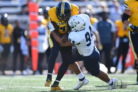 Sophomore Dylan Ruiz collects one of his three sacks against Towson.