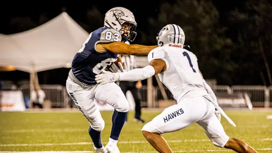 Andrew Edgar looks for running room against Monmouth.
