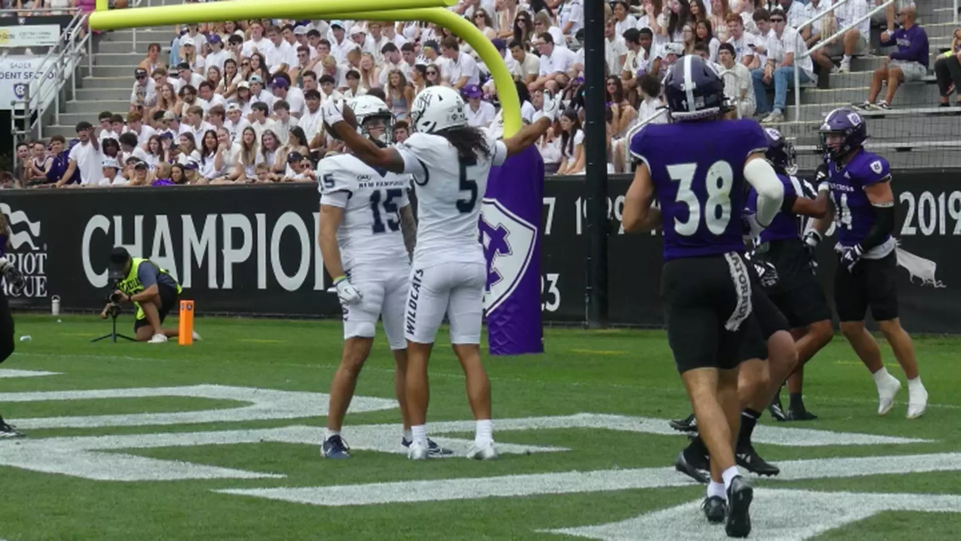 Logan Tomlinson and Joey Corcoran celebrate Logan's first TD catch of the afternoon.