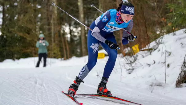 Luci Anderson '24 skiing in the 2024 UVM Carnival