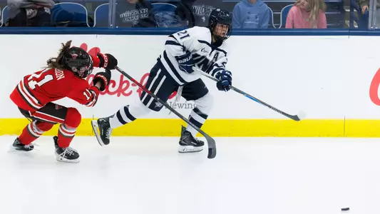 Danika Botterill skates to the puck