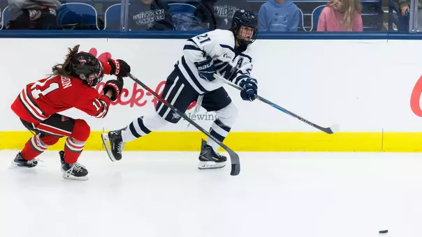 Danika Botterill skates to the puck