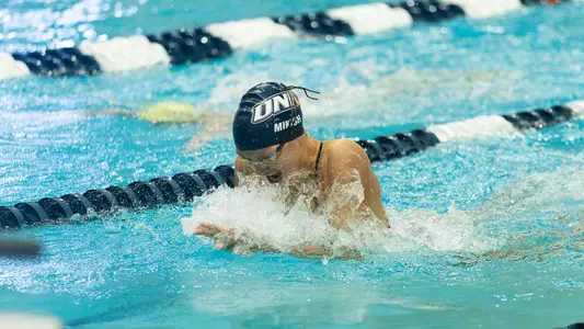 Anna Mikish races at Swasey Pool vs UVM on Oct. 17, 2026