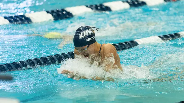 Anna Mikish races at Swasey Pool vs UVM on Oct. 17, 2026
