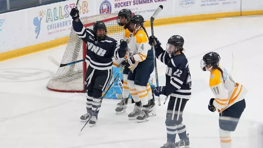 Julia Cabral and Charlie Rauch celebrate a goal against LIU