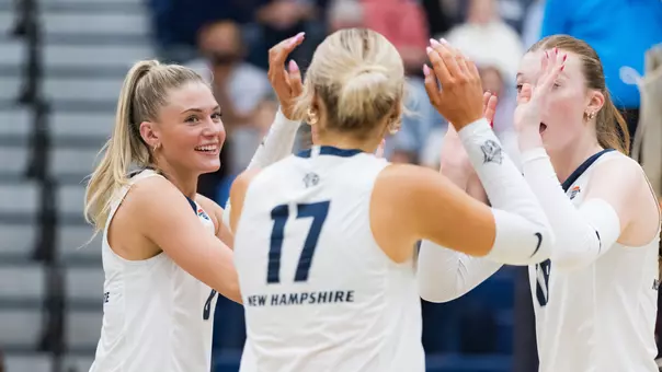Emma Converse and teammates celebrate