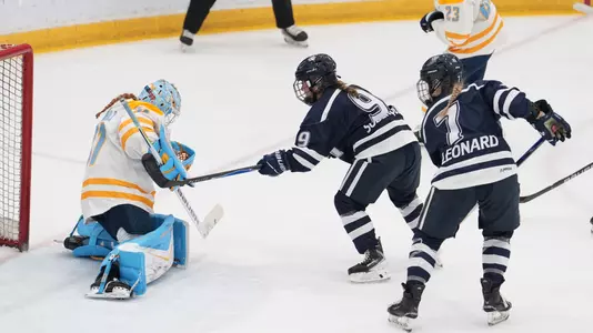 Madelyn Soderquist plays the puck on net