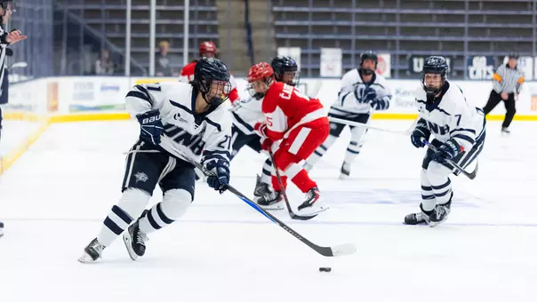 Danika Botterill skates with the puck.