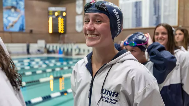 Audrey Mahoney smiles before a meet at Swasey Pool in 2026
