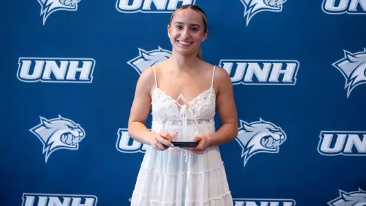 Freshman Amelia Lannon poses with her 2026 UNH Gymnastics Rookie of the Year award