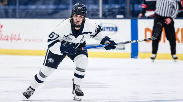 #67 Alyson Hush skates to the puck