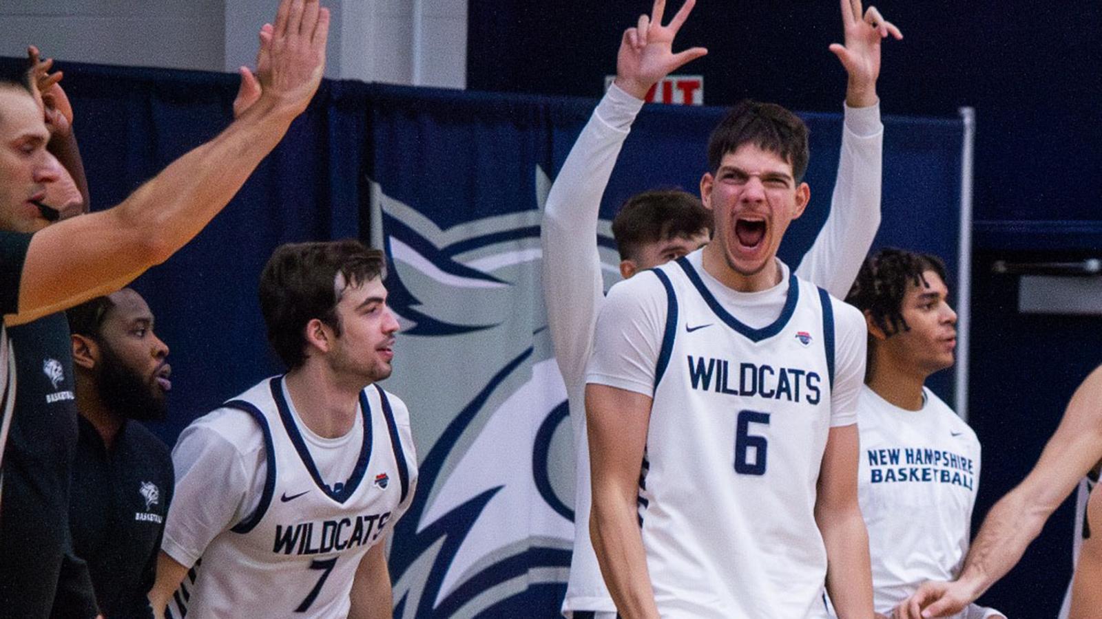 2025-26 UNH men's basketball team bench celebration led by Giannis Xanthopoulos