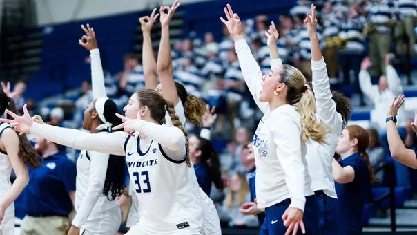 UNH women's basketball bench players celebrate made 3-point basket during 2025-26 season
